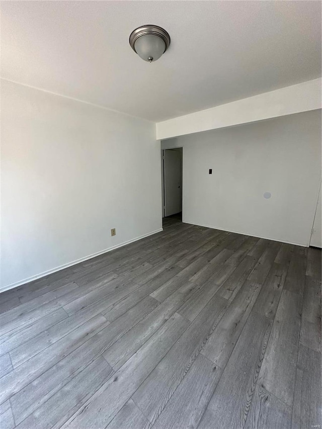 spare room with hardwood / wood-style floors