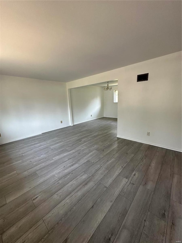 spare room with wood-type flooring