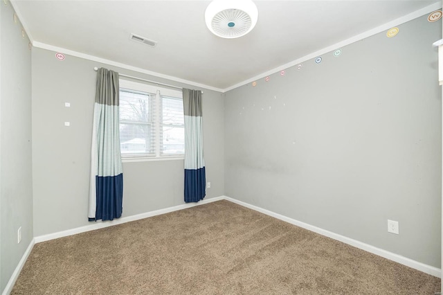 carpeted empty room with crown molding