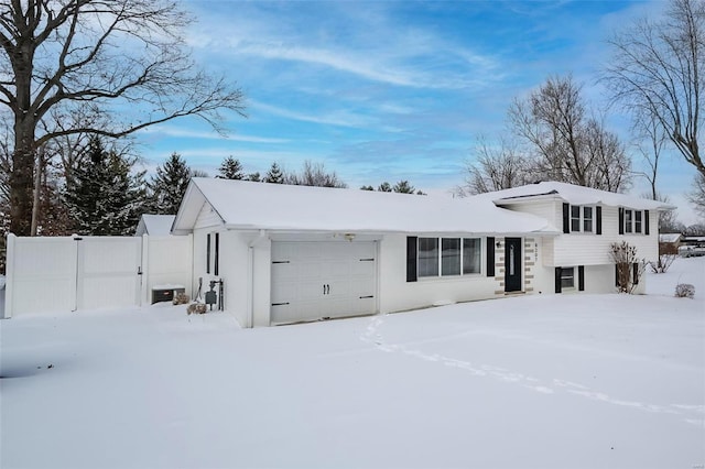 split level home with a garage