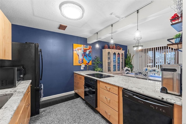 kitchen featuring beam ceiling, black appliances, baseboards, and light stone countertops