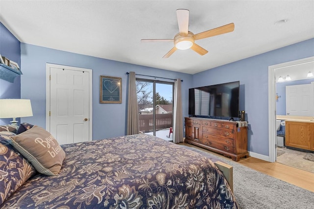 bedroom featuring connected bathroom, baseboards, light wood-style floors, a ceiling fan, and access to outside