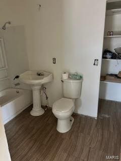 bathroom featuring toilet and hardwood / wood-style flooring