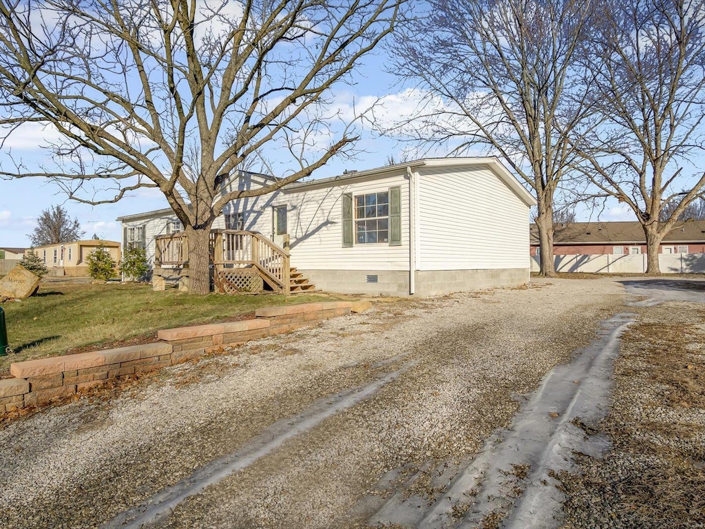 view of side of property with a yard