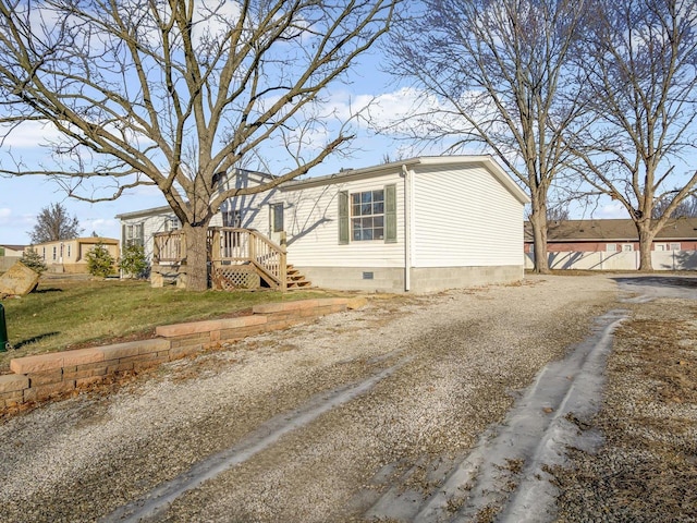 view of side of property with a yard