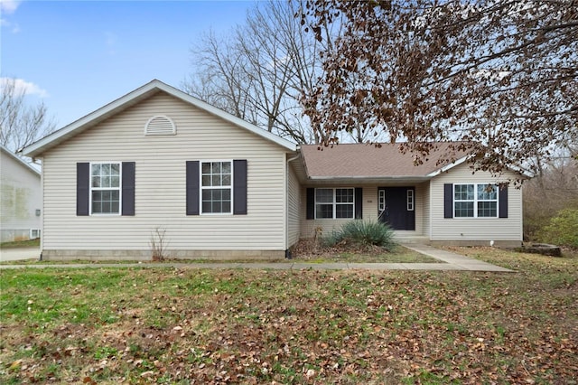 ranch-style house with a front lawn