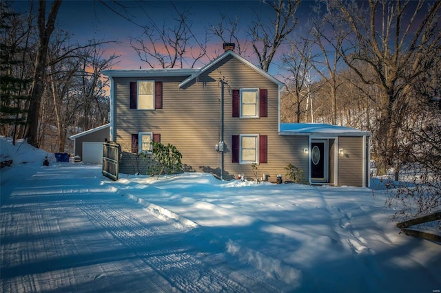 view of front of home with an outbuilding and a garage