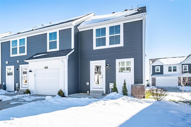 view of front of property featuring board and batten siding and a garage