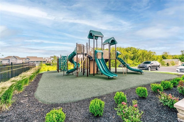 communal playground featuring fence