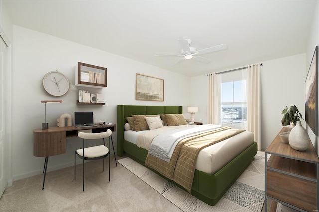 bedroom with ceiling fan and light colored carpet