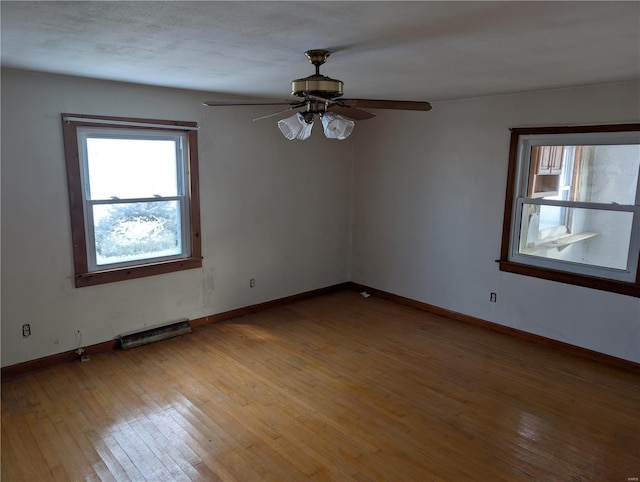 unfurnished room with light hardwood / wood-style floors and ceiling fan