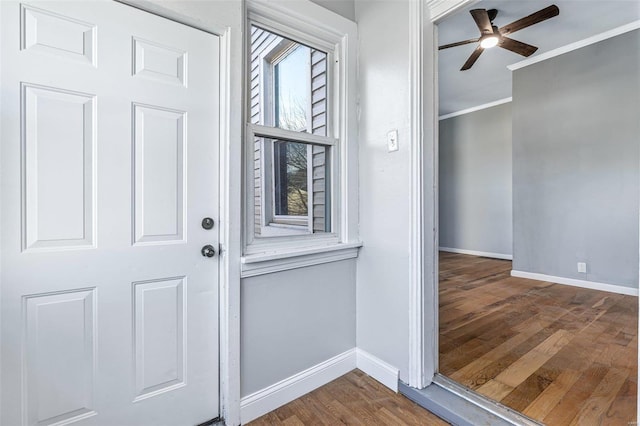 interior space featuring ceiling fan, ornamental molding, and hardwood / wood-style floors