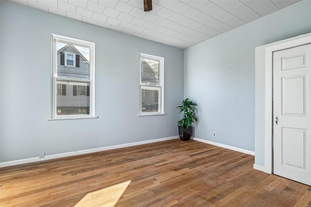 spare room featuring hardwood / wood-style floors