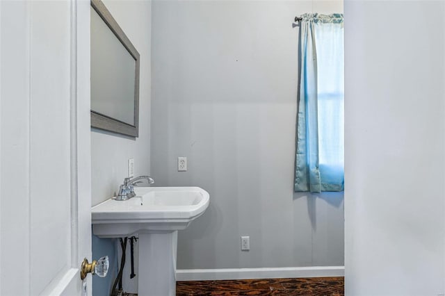 bathroom with sink and hardwood / wood-style floors