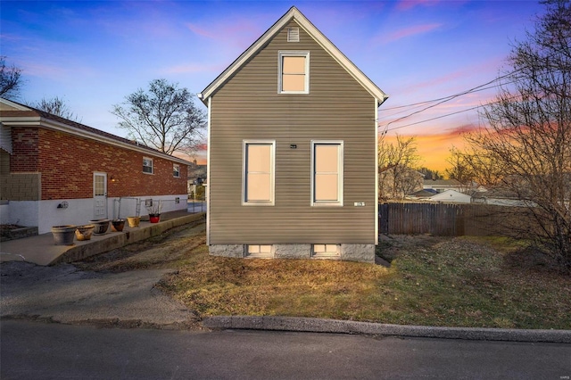 view of property exterior at dusk