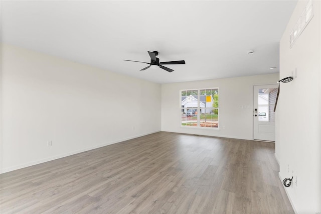 unfurnished room with ceiling fan and light hardwood / wood-style flooring