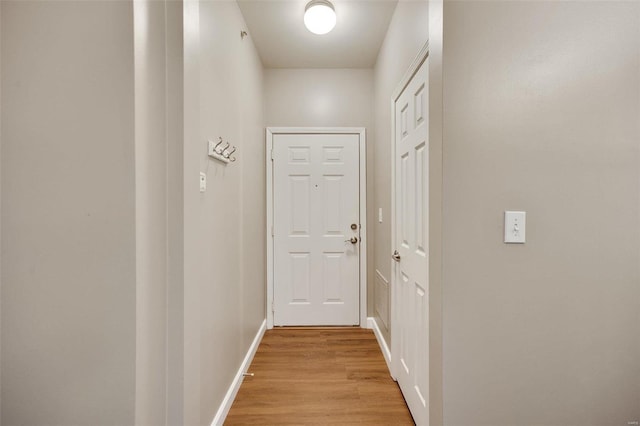 hall with light hardwood / wood-style floors