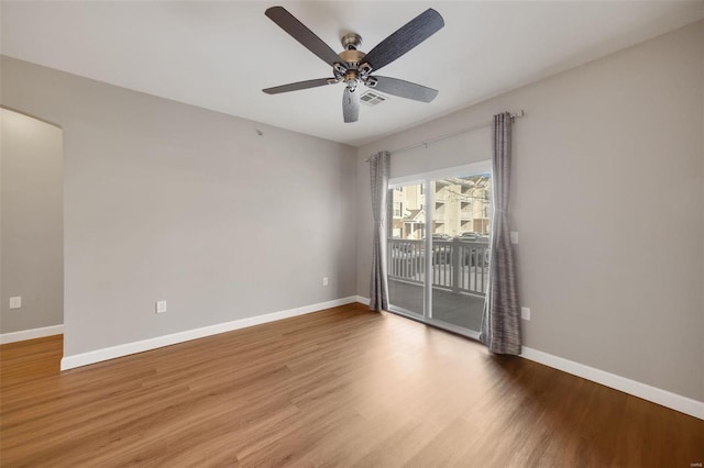 empty room featuring ceiling fan and wood-type flooring