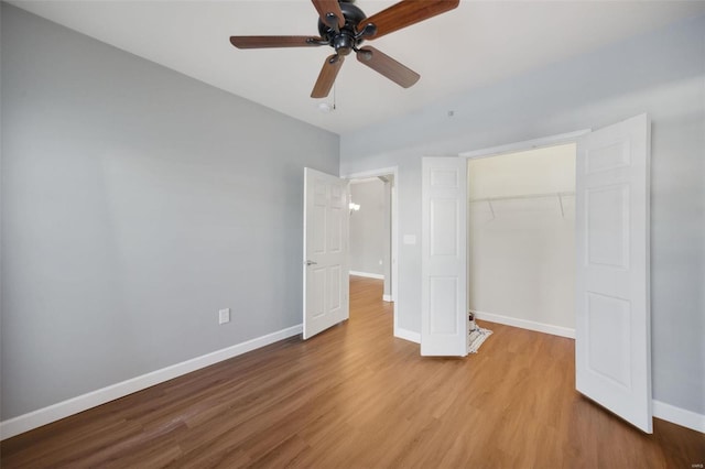 unfurnished bedroom with light wood-type flooring, a closet, and ceiling fan