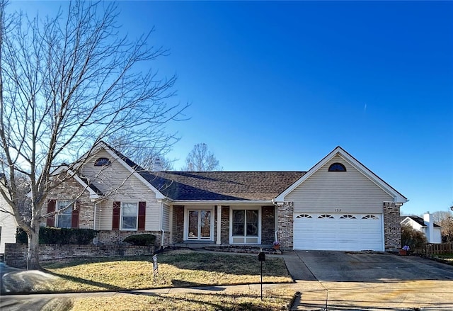 ranch-style home with a front yard and a garage