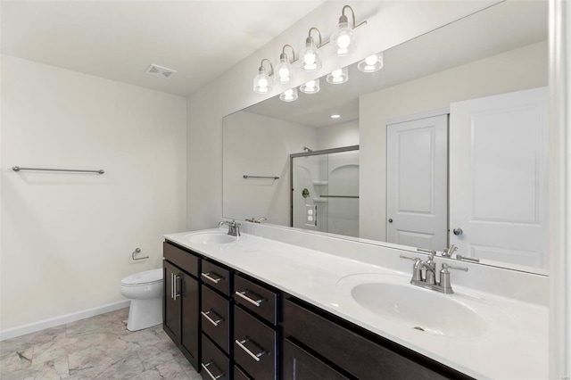 bathroom with toilet, an enclosed shower, and vanity