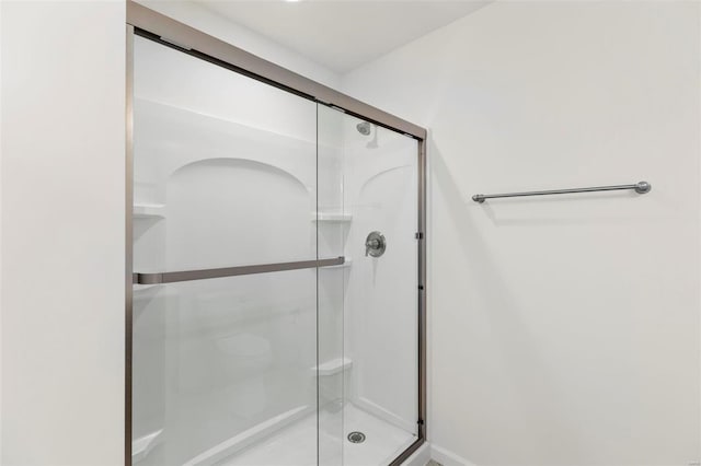 bathroom featuring an enclosed shower