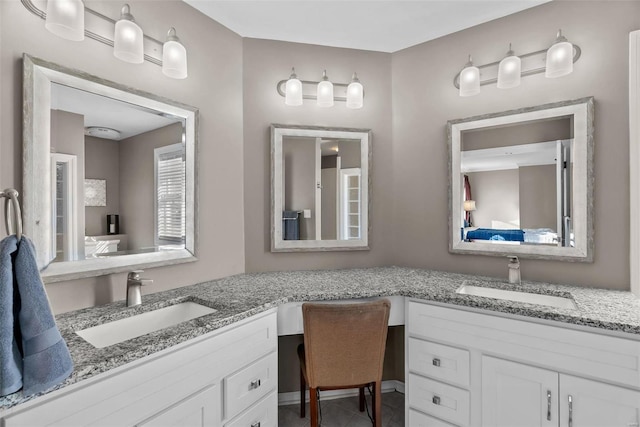 bathroom with tile patterned flooring and vanity