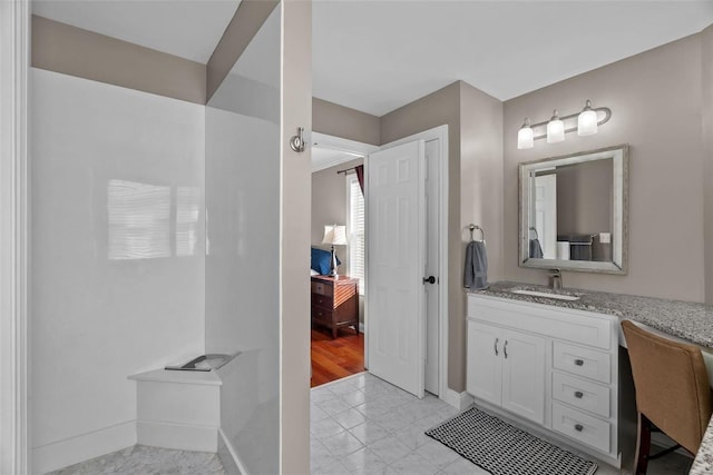 bathroom featuring tile patterned floors and vanity