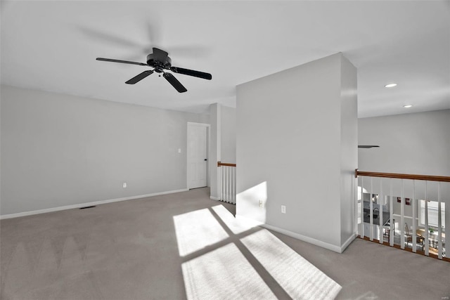 carpeted empty room with ceiling fan