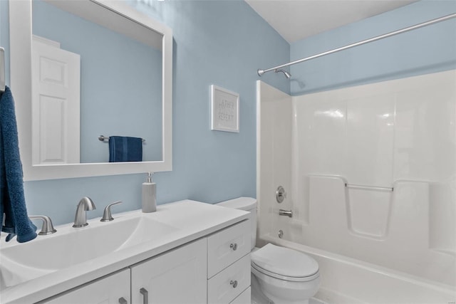 full bathroom featuring toilet, vanity, and  shower combination