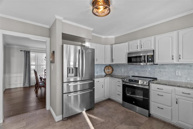 kitchen featuring stainless steel appliances, white cabinetry, ornamental molding, and light stone counters