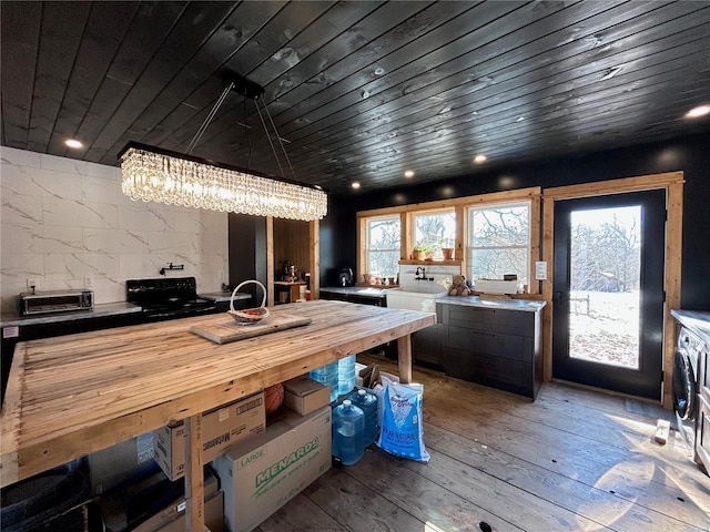 kitchen featuring light hardwood / wood-style floors, wood ceiling, and a wealth of natural light