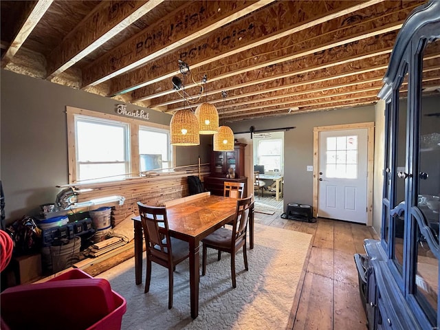 dining space featuring wood-type flooring