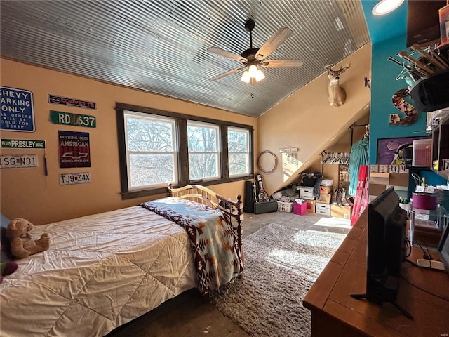 bedroom featuring ceiling fan and vaulted ceiling