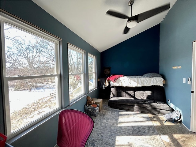 carpeted bedroom with ceiling fan, lofted ceiling, and multiple windows