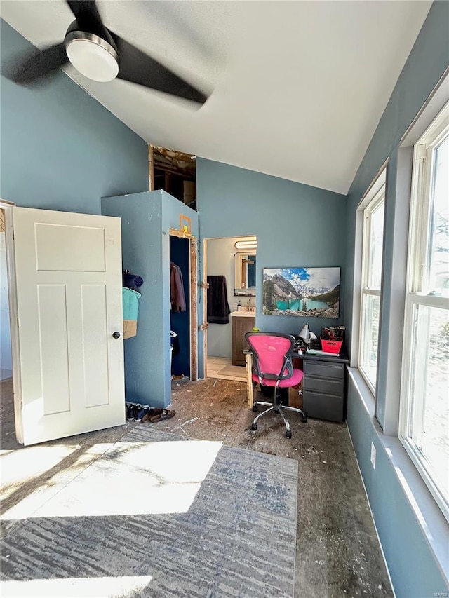 home office featuring ceiling fan and lofted ceiling