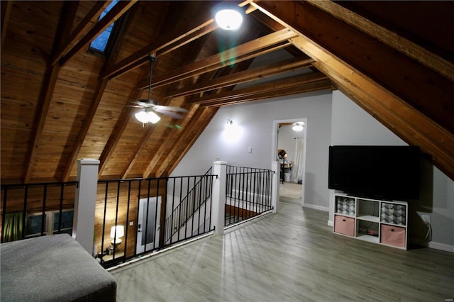 bonus room with lofted ceiling with beams, wooden ceiling, and ceiling fan