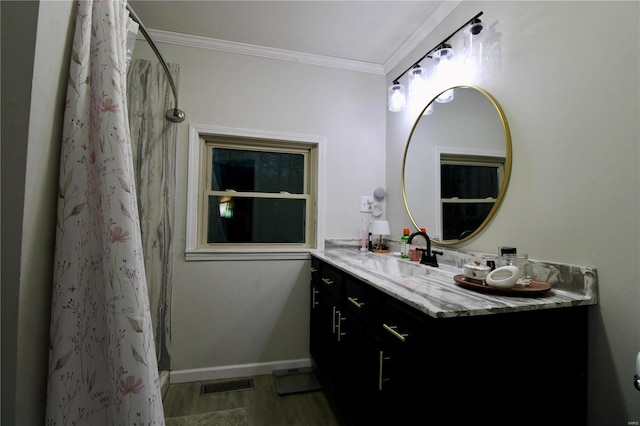 bathroom with ornamental molding, wood-type flooring, vanity, and a shower with curtain