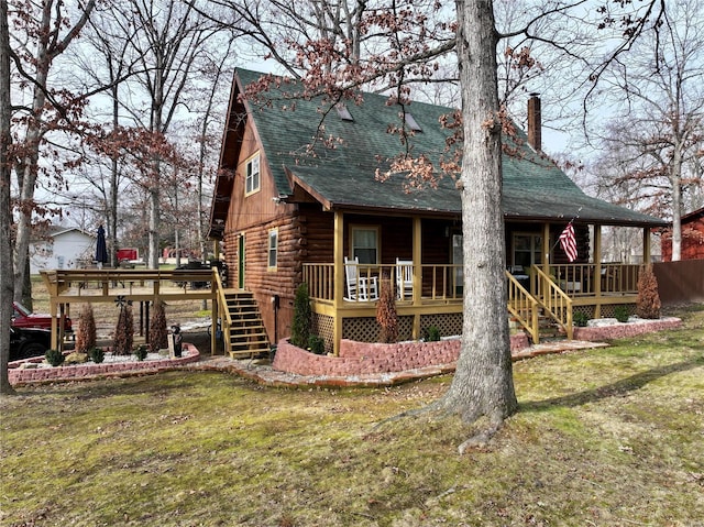 back of house featuring a yard and a deck