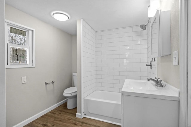 full bathroom featuring wood-type flooring, vanity, bathing tub / shower combination, and toilet