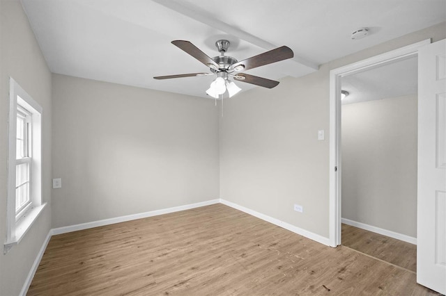 spare room featuring ceiling fan and light wood-type flooring