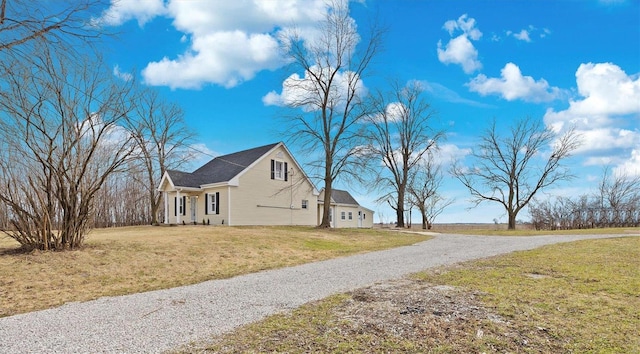 view of property exterior with a lawn