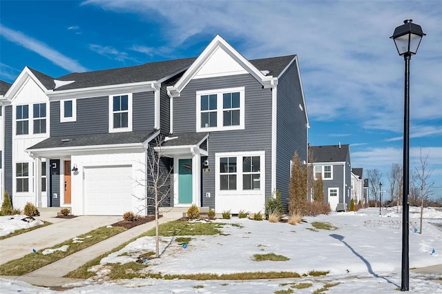 townhome / multi-family property featuring a garage