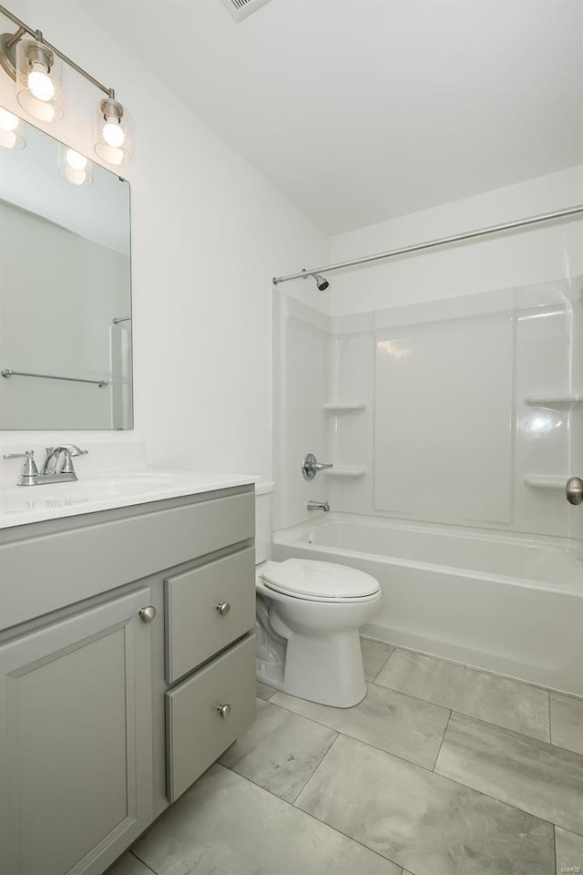 full bathroom with vanity, shower / washtub combination, and toilet