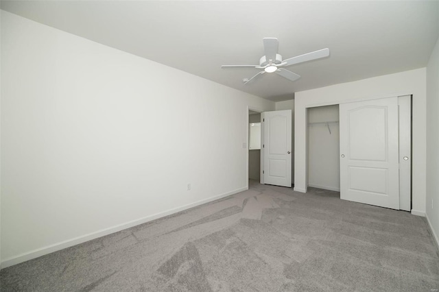 unfurnished bedroom with light carpet, a closet, and ceiling fan