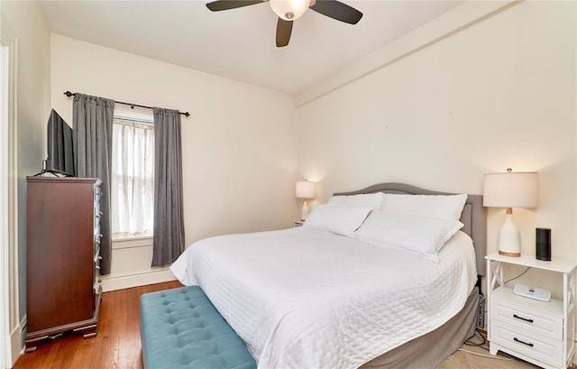 bedroom with ceiling fan and wood finished floors