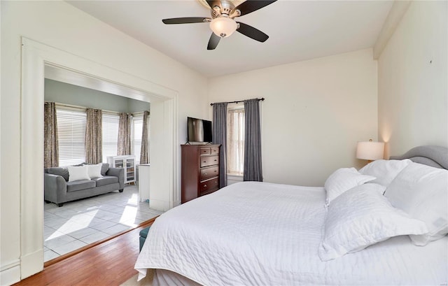 bedroom featuring tile patterned floors and ceiling fan