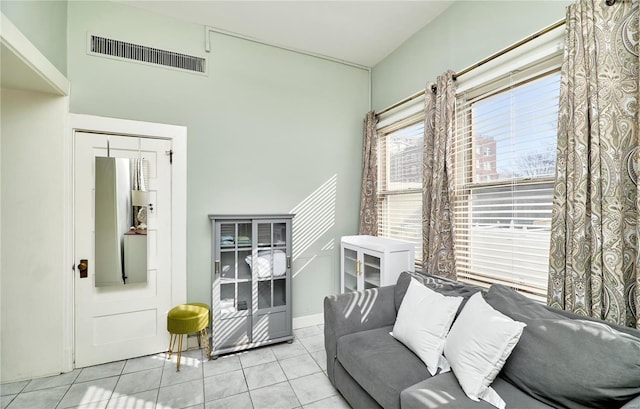 tiled living area featuring visible vents