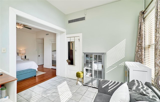 bedroom with light tile patterned flooring and visible vents