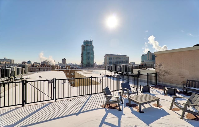 view of patio / terrace with a city view and central air condition unit